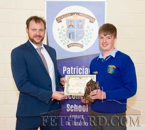 Michael Flanagan receiving the T.Y. Student of the Year award from Principal Mr Billy Walsh. 