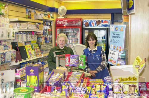 Goldie Newport chatting with her former employee Rebecca Conway in Newport's newsagency. Rebecca worked for Goldie for 11 years in her grocery shop a few doors down on Main Street, and now works in Edwina Newport's newsagency. Goldie retired from the grocery business in August 2000.