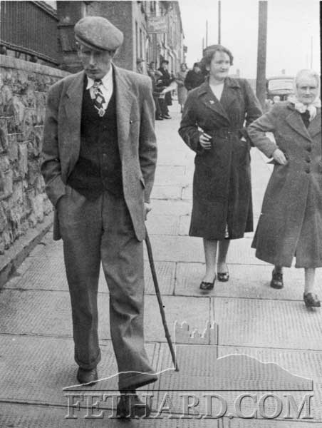 Neddy Sheehan with Peggy O'Reilly and her mother Mrs O'Reilly, Barrettstown, in the background. 