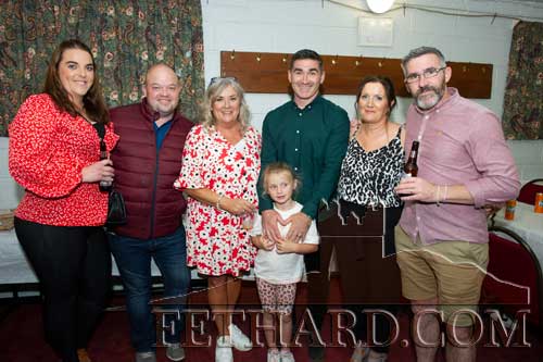 

L to R: Eimear Gahan and Brian Egan, who made the Birthday Cake for Jimmy, photographed with members of the Coen family and young Emily Coen in front.