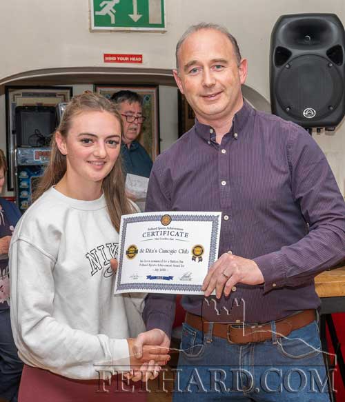 Allison Connolly, accepting the Sports Achievement Award Nomination Certificate for July on behalf of St. Rita's Camogie Club, from this month's sponsor, Des O'Meara, Physiotherapy & Sports Injury Clinic, Tullamaine, Fethard.