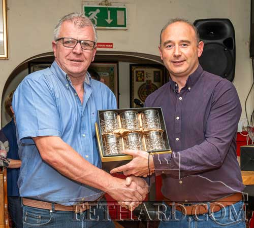 John Ward accepting the July 'Mentor of The Month' award, from this month's sponsor, Des O'Meara, Physiotherapy & Sports Injury Clinic, Tullamaine, Fethard. John is an avid member of Tipperary Light Car & Motorcycle Club for the past 35 years.
