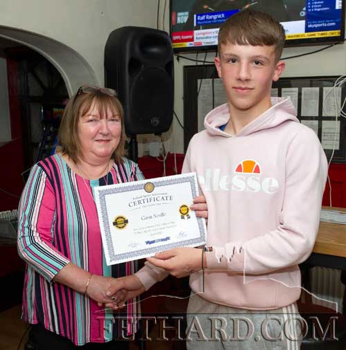 Gavin Neville receiving his April Sports Award Nomination Certificate from Anne Butler, representing this month's sponsor, Butler's Sports Bar. Gavin has the distinction of being selected by Tipperary at U15 level for hurling and football.