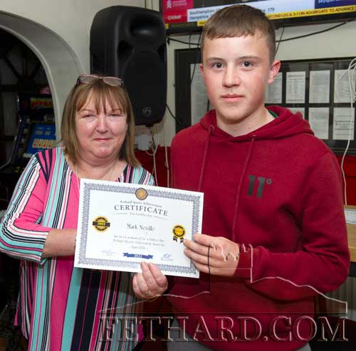 Mark Neville  receiving his April Sports Award Nomination Certificate from Anne Butler, representing this month's sponsor, Butler's Sports Bar. Mark was selected by Tipperary's U16 management as part of the squad for 2022.