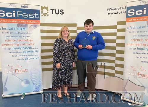 John David O'Donnell, a second year student at Patrician Presentation Fethard is seen here receiving the Boston Scientific Medical Devices Award  at the Scifest Regional final in the TúS Campus Thurles recently. John David developed a prototype of a wheelchair attachment to improve the accessibility of wheelchair users to climb steps. He was entered in the Junior Individual Technology category. John David is pictured above with Ms Catriona McKeogh, Deputy Principal. Well done John David.