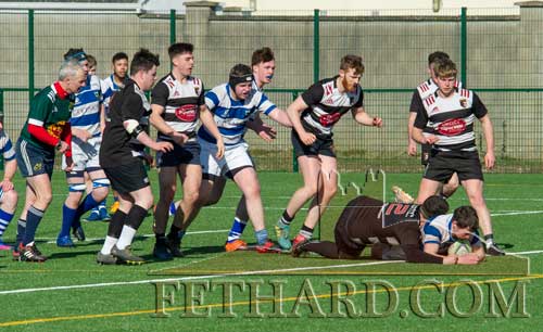 Conor Kavanagh bursts through to score Fethard's first try before half time.