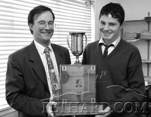 Pupil of the year Eoin Doyle, Strylea, Fethard receiving the “Padraig Pearse Perpetual Memorial Cup “ from Mr Ernan Britton, principal Patrician Presentation Secondary School Fethard on October 6, 1998