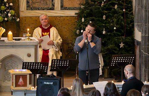 John Cummins (teacher), playing a beautiful rendition of 'O Holy Night' on harmonica, accompanied by Stuart Clooney on piano, at the Patrician Presentation Secondary School's Christmas Celebration held at the Augustinian Abbey, Fethard