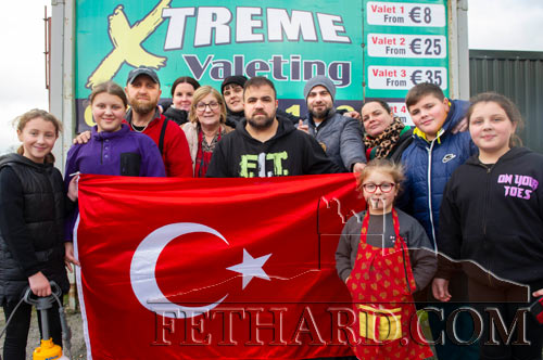 Huseyin ‘Coco’ Barlaz, Extreme Carwash & Valeting, photographed with his extended family at The Green, Fethard, where they raised much needed funds for those affected by the recent earthquakes in Turkey.