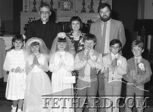 Fr. Tony Lambe, Angela Dillon-White, Danny Kane with first Holy Communion children in Killusty Church in June 1987